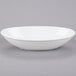 A Libbey Porcelana Infinity white oval bowl.
