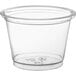 A clear plastic souffle cup with a lid.