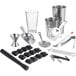 A Choice 13-piece Ultimate Cocktail Kit on a counter with a metal funnel, spoon, and white shaker.