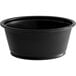 A Choice black plastic souffle cup with a white background.