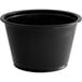 A black plastic Choice souffle cup.