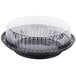 A D&W Fine Pack black plastic pie container with a clear high dome lid.