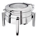 An Eastern Tabletop stainless steel round chafer with a glass dome lid on a stand.