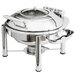 A silver stainless steel Eastern Tabletop Crown chafer with a lid on a table.