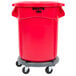 A red Rubbermaid BRUTE trash can with a dolly.