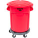 A red Rubbermaid BRUTE trash can with lid and dolly.