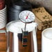 A Taylor instant read probe thermometer in a metal container.