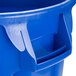 A blue Rubbermaid BRUTE round trash can with a lid and dolly.