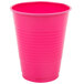 A close-up of a Creative Converting hot magenta pink plastic cup.