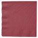A Creative Converting burgundy paper dinner napkin with a folded edge.