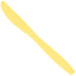 A close-up of a yellow Creative Converting plastic knife.