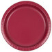 A close-up of a Creative Converting burgundy paper plate with a white background.