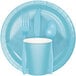 A close up of a Creative Converting pastel blue paper plate with a fork, spoon, and knife.