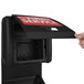 A hand opening a black Commercial Zone Vue-T-Ful Isle full service box.