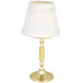 A Sterno La Rue polished brass table lamp with a Marlowe ivory shade.