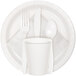 A white Creative Converting paper plate with a spoon, fork, knife, and white cup.