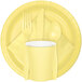 A close up of a Creative Converting Mimosa Yellow Paper Plate with a fork, spoon, and yellow cup.