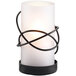 A Sterno Oleana frost lamp with a white candle in a black wire stand.