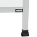 An Aarco aluminum A-frame sidewalk sign with white porcelain boards on black legs.