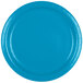 A close-up of a Creative Converting turquoise blue paper plate.