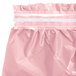 A Classic Pink plastic table skirt with a white stripe.