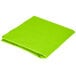 A Fresh Lime Green OctyRound table cover folded up on a white background.