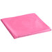 A folded pink Creative Converting OctyRound plastic table cover on a white background.