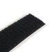 A black mat with a white strip of Cactus Mat loop fastener tape.