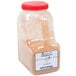 A plastic container of brown Regal Cinnamon Sugar powder.
