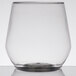 A clear plastic WNA Comet stemless wine goblet with a small amount of liquid in it.