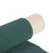 A roll of green PVC coated polyester fabric.