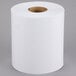 A Lavex white center pull paper towel roll on a white surface.