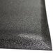 A black Cactus Mat anti-fatigue floor mat with a black surface.