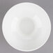 A white American Metalcraft porcelain footed bowl on a gray background.