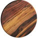 An American Metalcraft faux acacia wood charger plate with a black and brown circular design.