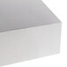 An American Metalcraft stainless steel rectangular riser on a white surface.