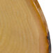 A close-up of an oval melamine serving board with a faux rustic wood surface.