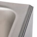 A close-up of a stainless steel APW Wyott countertop food warmer.