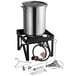 A Backyard Pro turkey fryer kit with a large stainless steel pot on a stand with tools.
