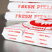 A stack of white Choice pizza slice boxes.