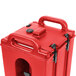 A red plastic Cambro Camtainer lid with black handles.