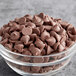 A bowl of Ghirardelli milk chocolate chips.