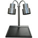 A stainless steel Hanson Heat Lamp with two metal arms over a black granite surface.