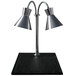 A Hanson Heat Lamps stainless steel carving station with two black metal lamps on a black synthetic granite base.