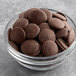 A bowl of Regal Premium dark chocolate coating wafers.