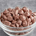 A bowl of Ghirardelli milk chocolate chips.