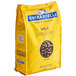 A yellow bag of Ghirardelli milk chocolate chips.