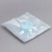 A plastic package containing white and blue Unger The Pill glass cleaner concentrate tablets.