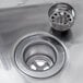 A Regency stainless steel wall mounted hand sink with a drain and a P-trap.