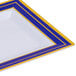 A close up of a Fineline white plastic square plate with blue and gold stripes.